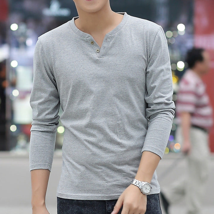 autumn linen long sleeve t shirts in light gray on a model in an urban setting.