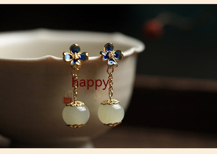 Flower Four Leaf Clover Ear Studs featuring gold-plated details and blue artificial gemstones.