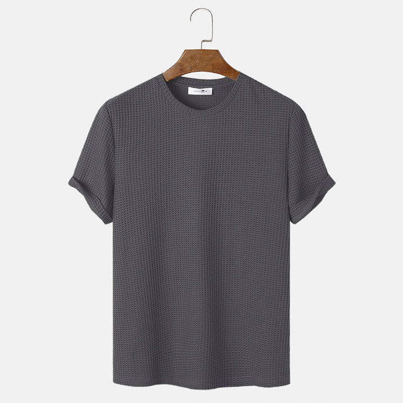 Men summer solid color t-shirts in dark grey with short sleeves on a hanger.
