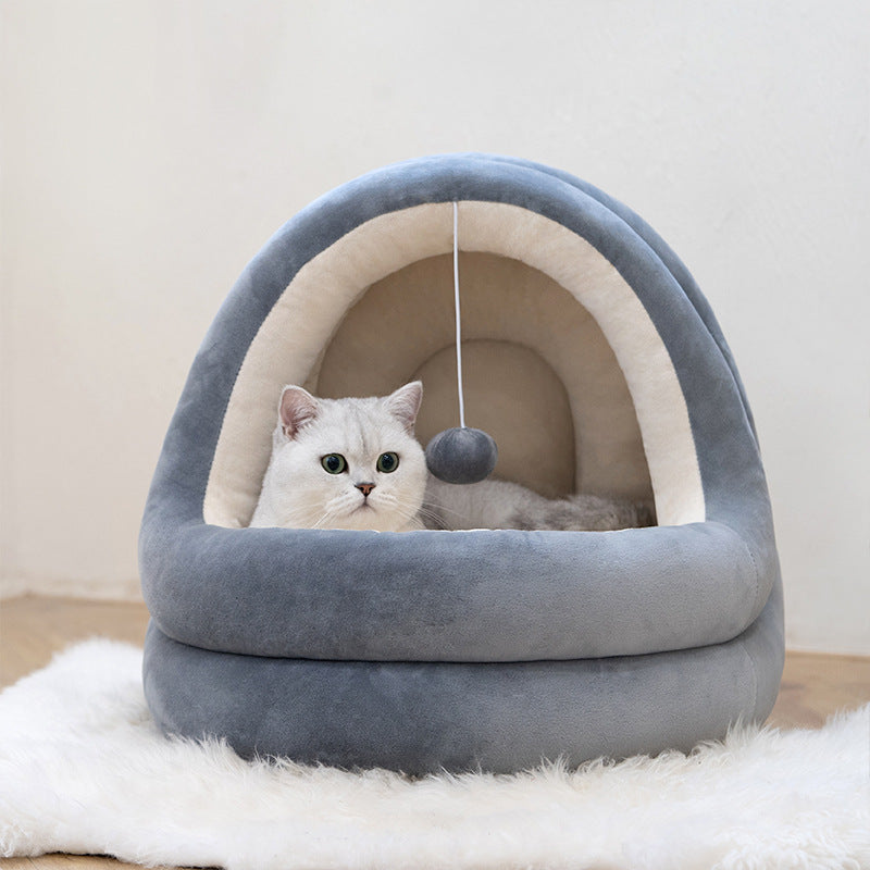 high quality cat house beds featuring a cozy, soft, gray bed with a playful toy and a relaxed cat inside.