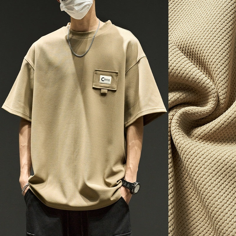 Waffle short sleeve men's summer shirt in beige with pocket detail and textured fabric.
