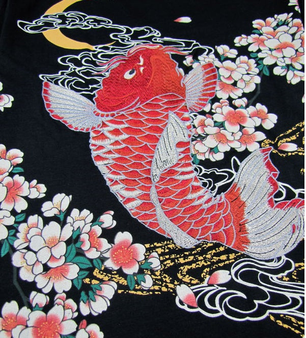 Unique embroidered t-shirts collection featuring vibrant koi fish design with cherry blossoms and intricate details.