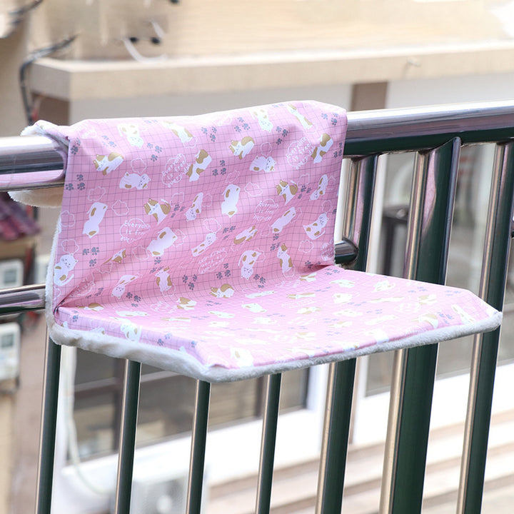 Solid Steel Frame Structure Super Portable Cat Nest on a balcony railing with a cute pink design.