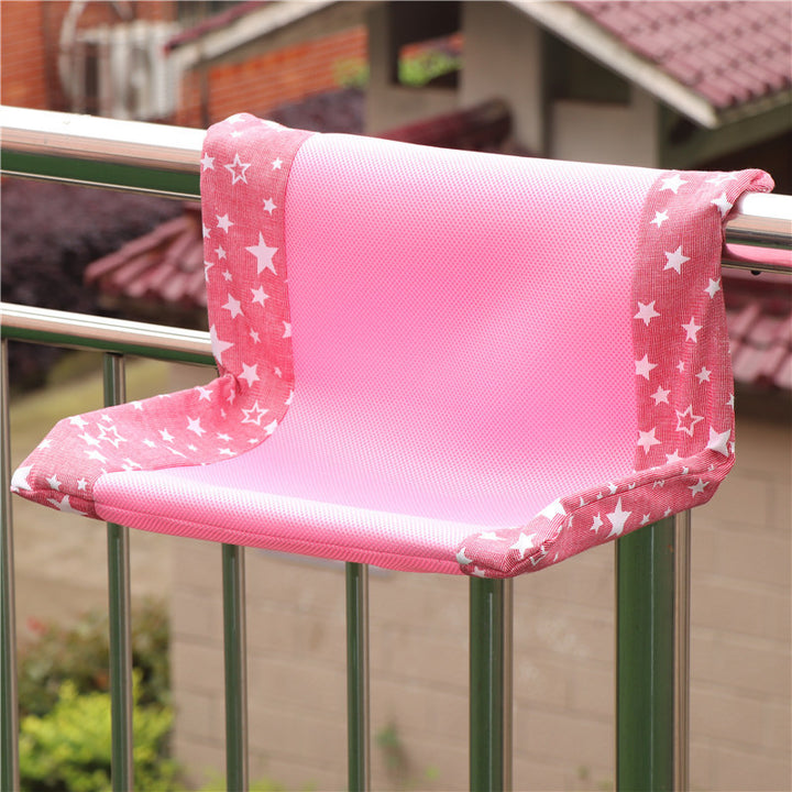 Super portable cat nest in pink with star pattern, designed for balcony use, providing comfort for cats.