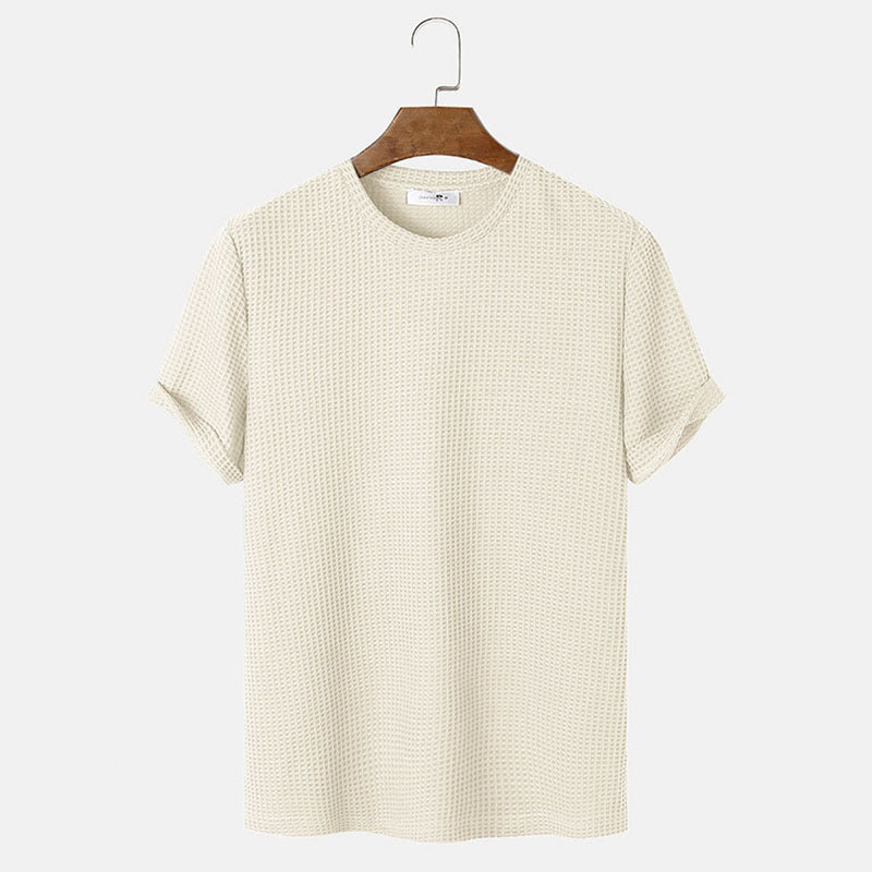 Men summer solid color t-shirts in beige hanging on a wooden hanger, featuring a comfortable crew neck design.