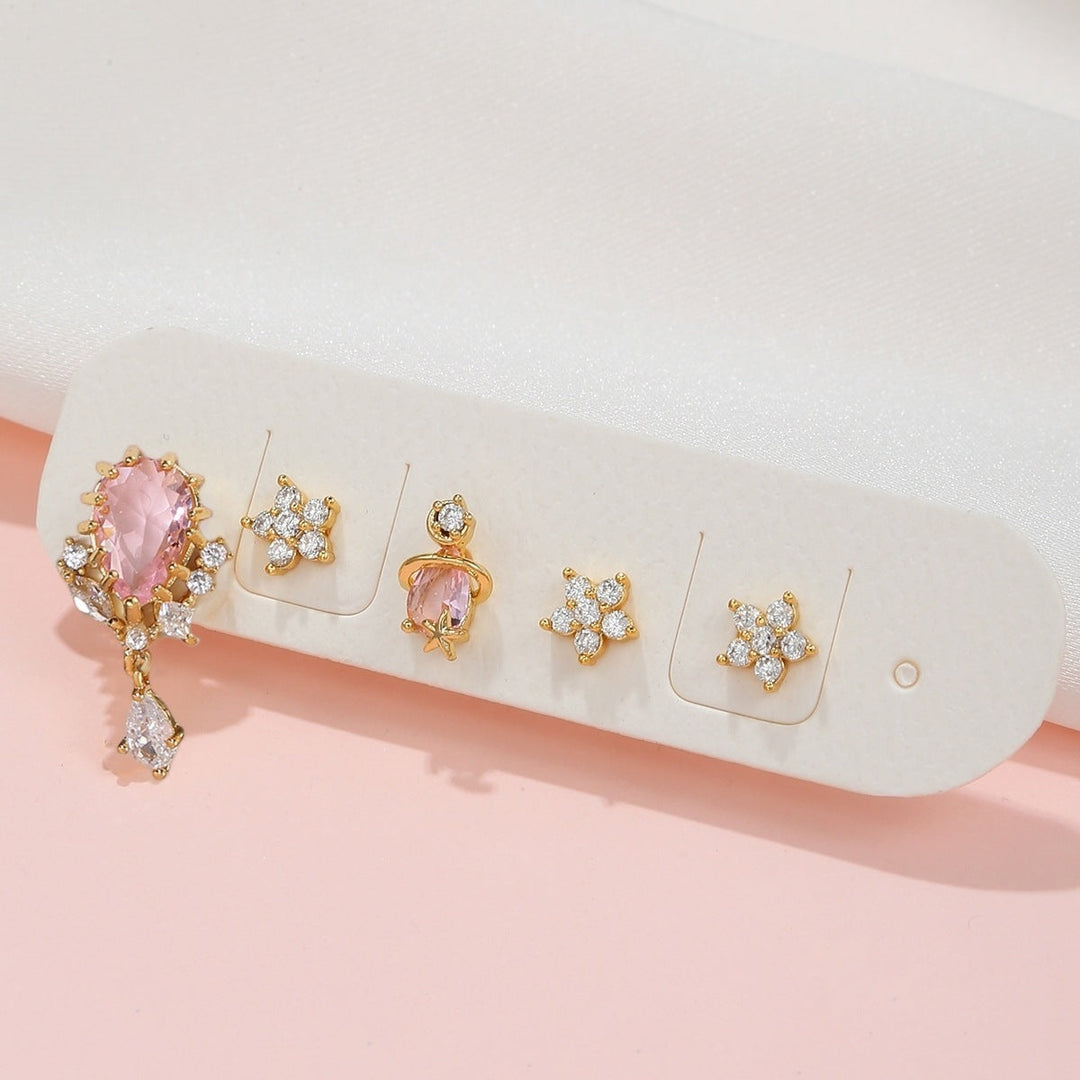 Gold zircon flower ear studs showcasing a floral design with pink and clear stones, perfect for elegant accessorizing.