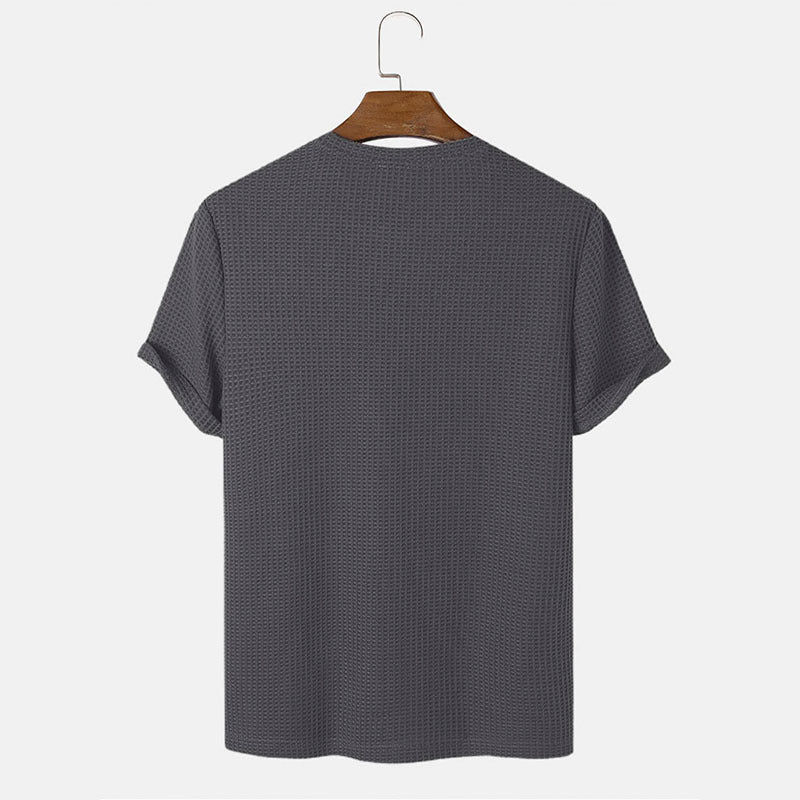 Men summer solid color t-shirts in dark grey hanging to showcase back view.