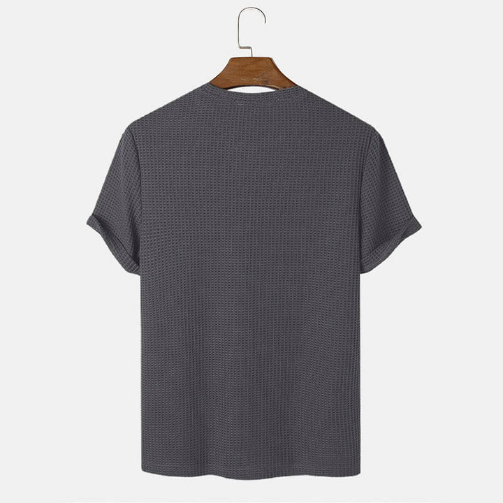 Men summer solid color t-shirts in dark grey hanging to showcase back view.