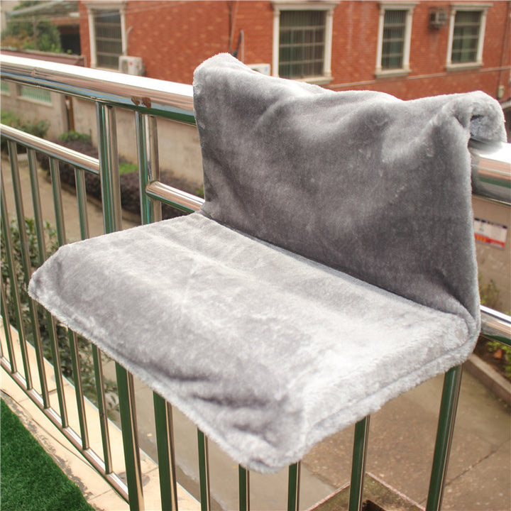 Solid Steel Frame Structure Super Portable Cat Nest with soft grey plush fabric for cats on a balcony railing.